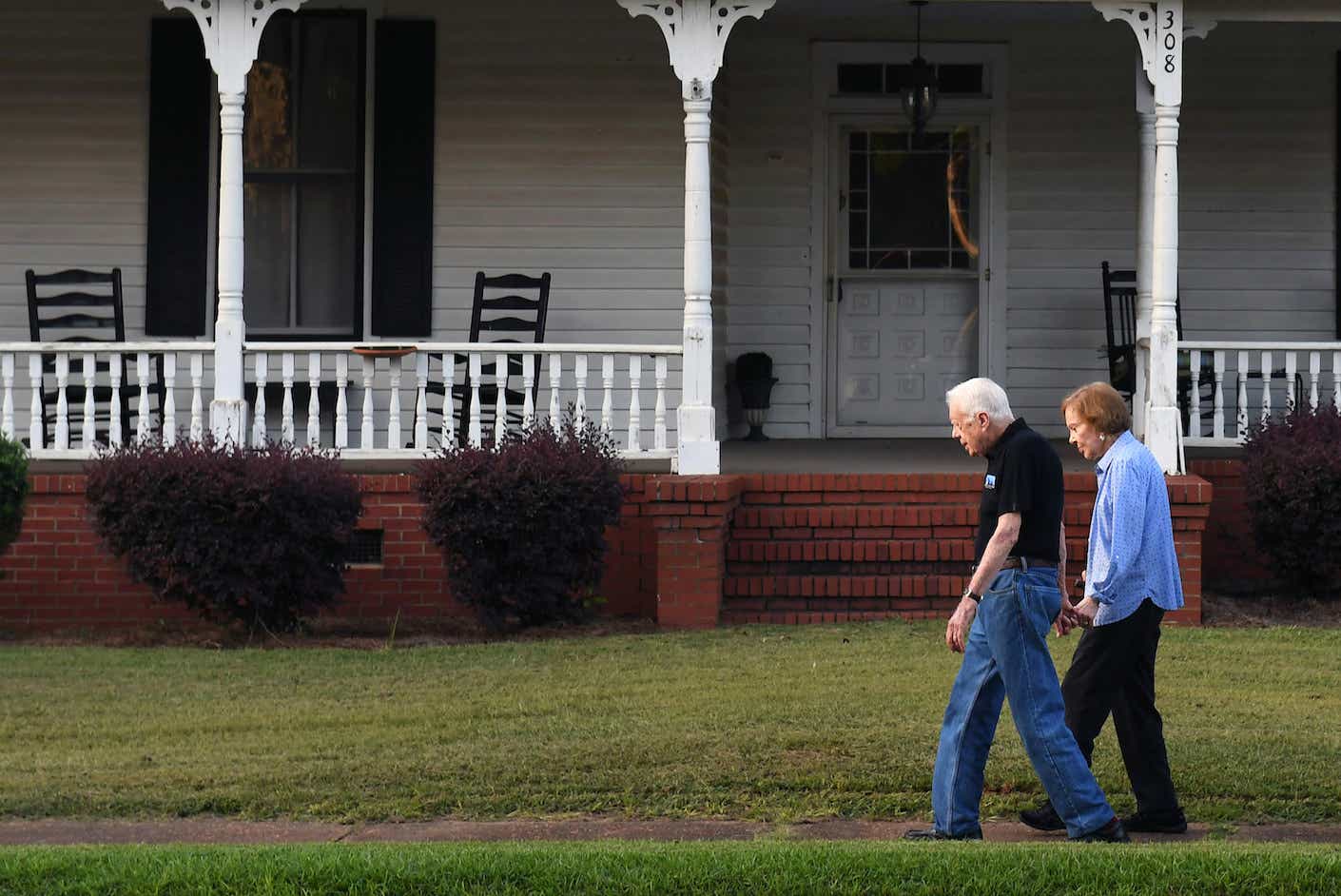 former President of the United States, Jimmy Carter walks with his wife, former First Lady, Rosalynn Carter towards their home following dinner at a friend's home on Saturday August 04, 2018 in Plains, GA