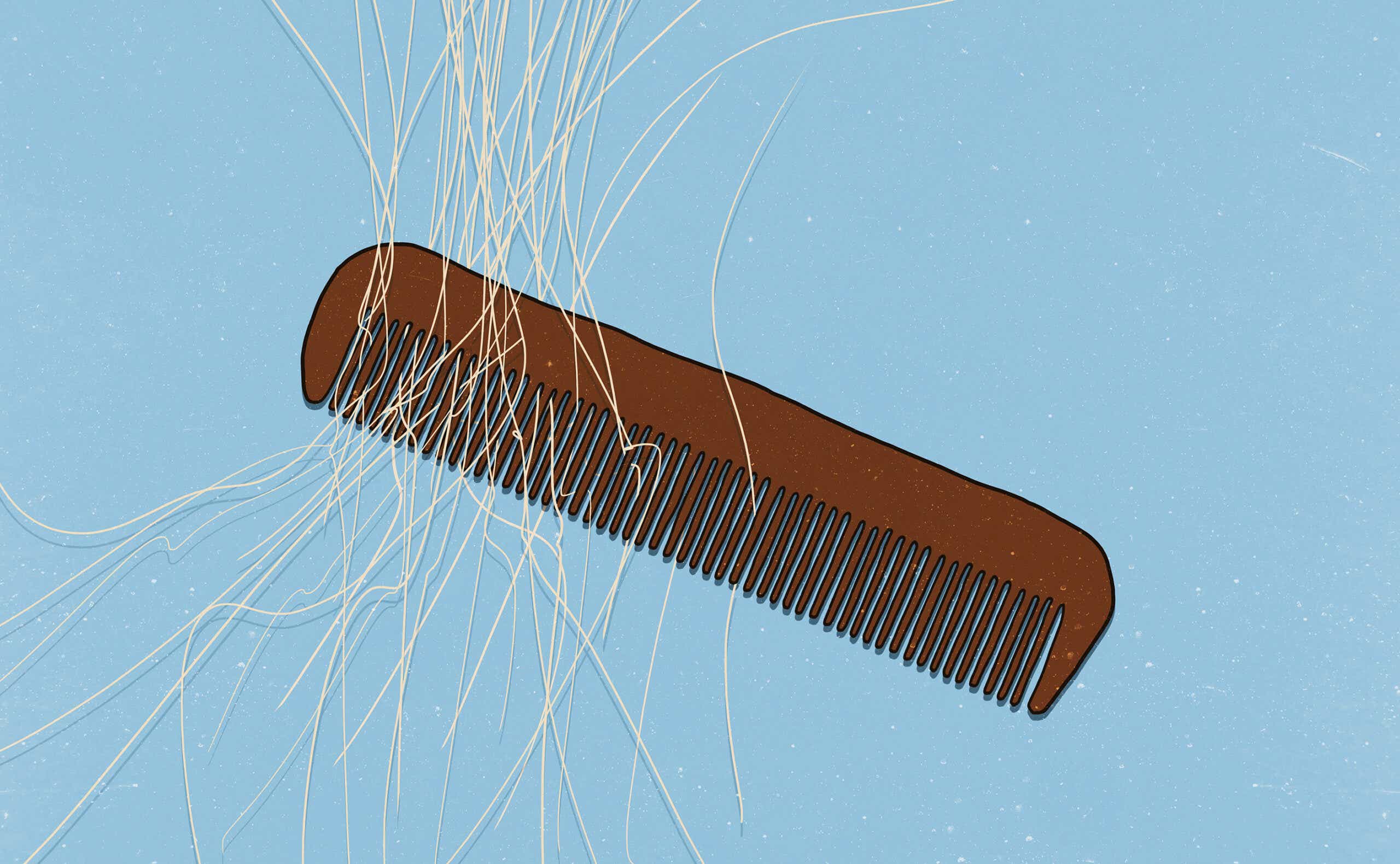 Brown comb with white hairs in it on a blue background