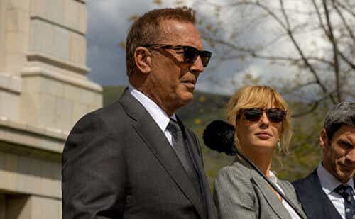 Kevin Costner, Kelly Reilly and Jamie Dutton wearing business attire and sunglasses, outside giving a press conference.
