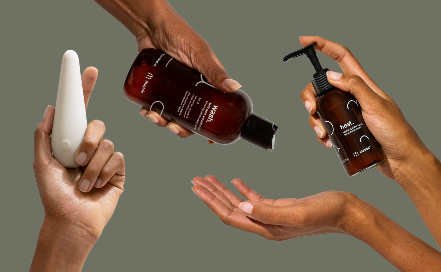 hands holding various maude products
