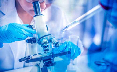 Women scientist looking through microscope in laboratory. Young scientist doing some research with dropper chemical double exposure.