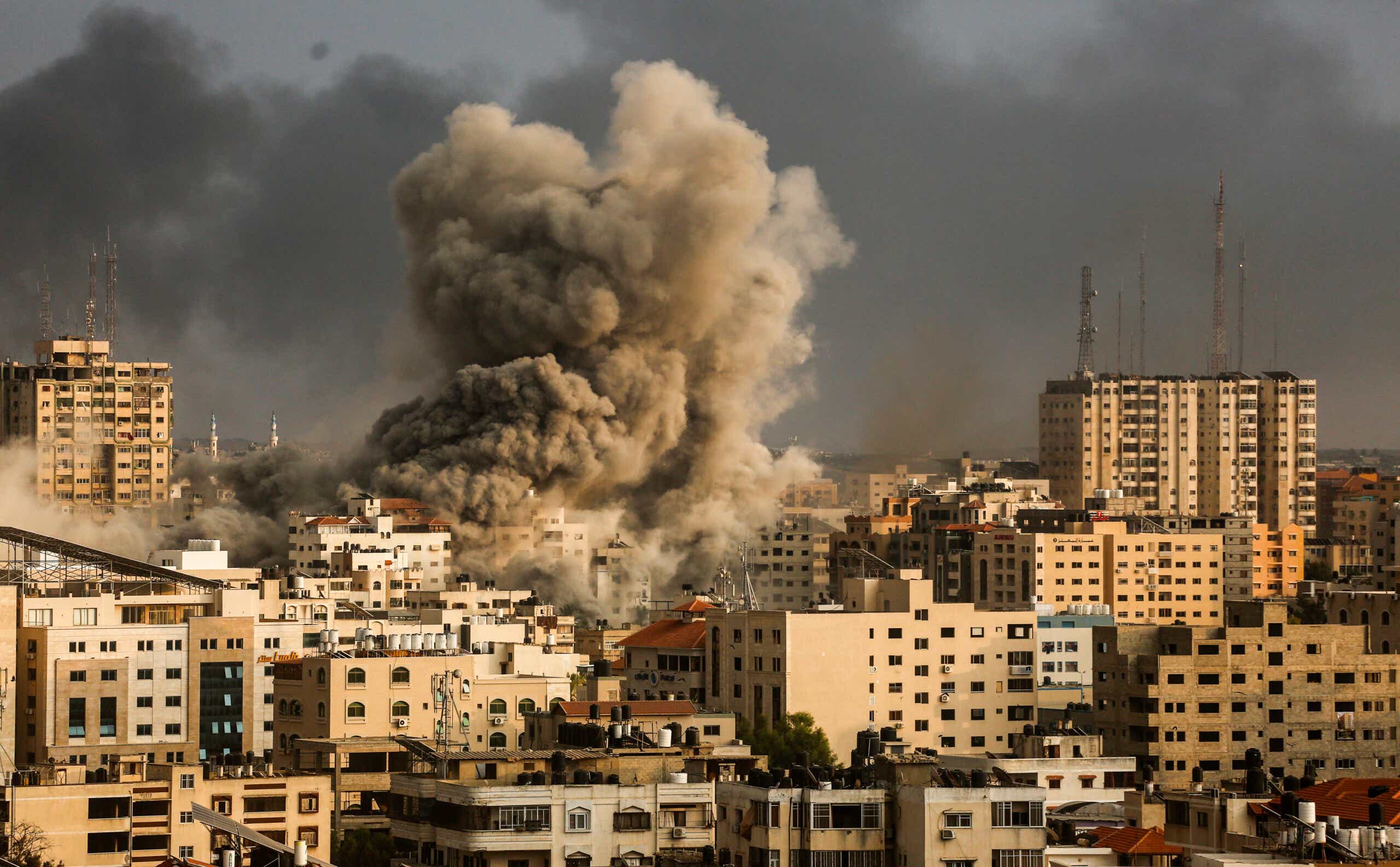 Massive billows of smoke rise over buildings in Gaza City