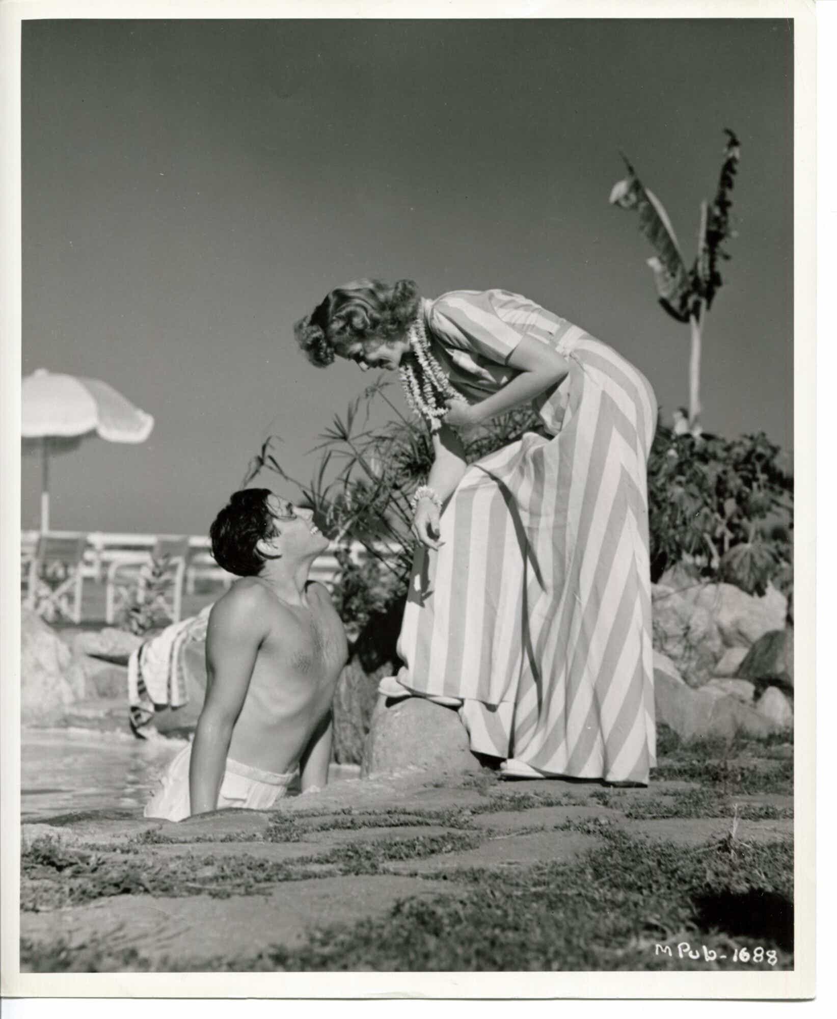 Lucille Ball and Desi Arnaz at home by their pool