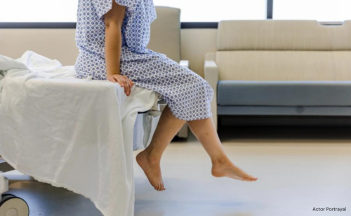 woman sitting on a hospital bed