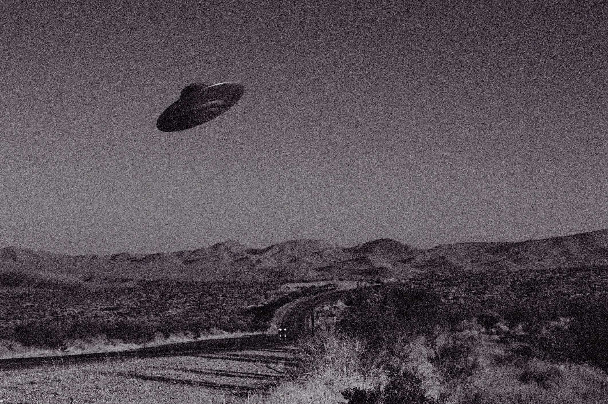 Image of a UFO over the desert, black and white