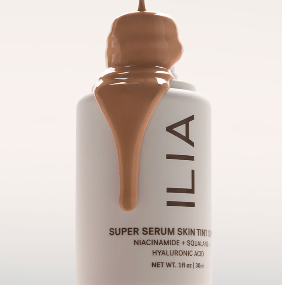 ILIA Super Serum Skin Tint spilling over top of bottle