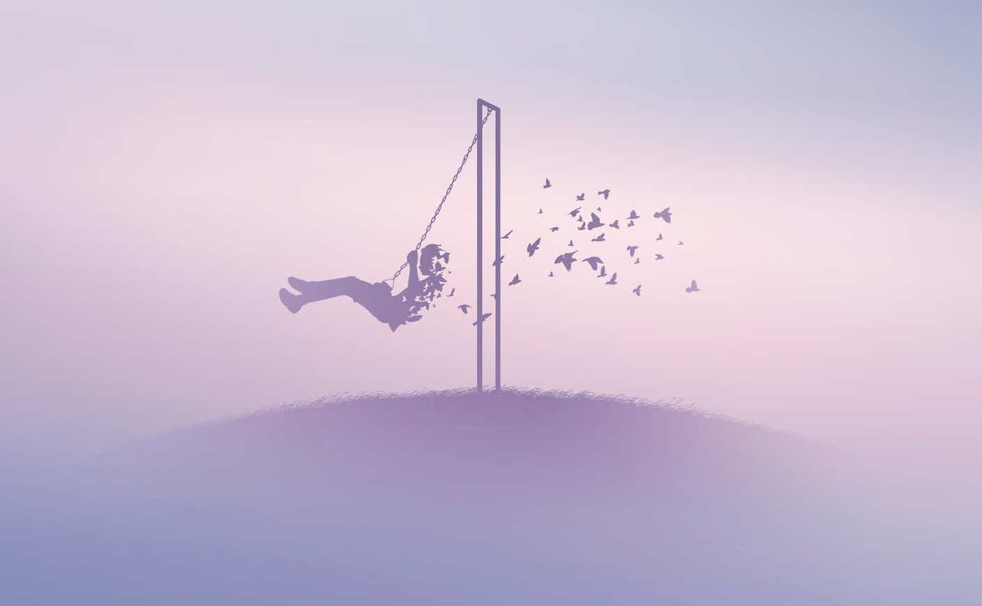 a boy on a swing blowing away