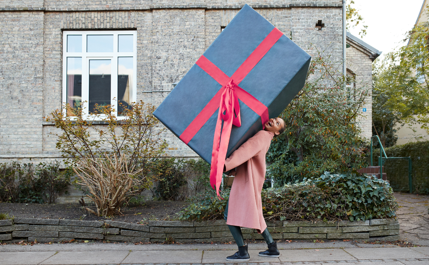 Woman holding a gigantic gift