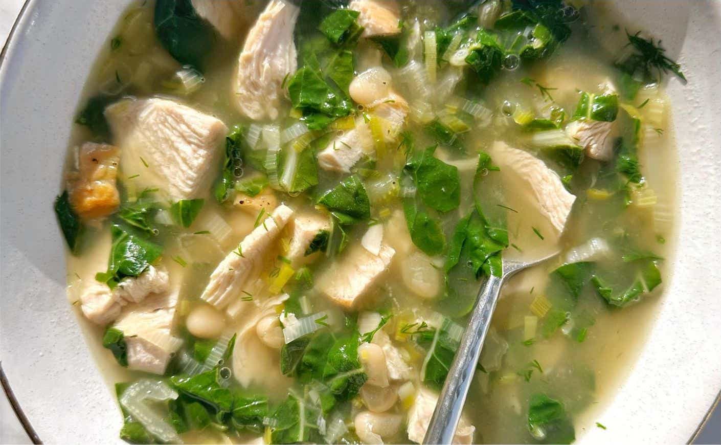 A bowl of white bean chicken soup.