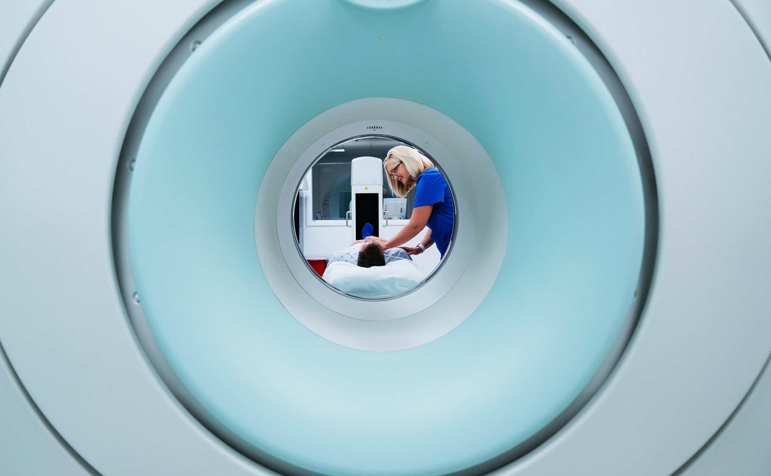A nurse prepares a patient for an MRI