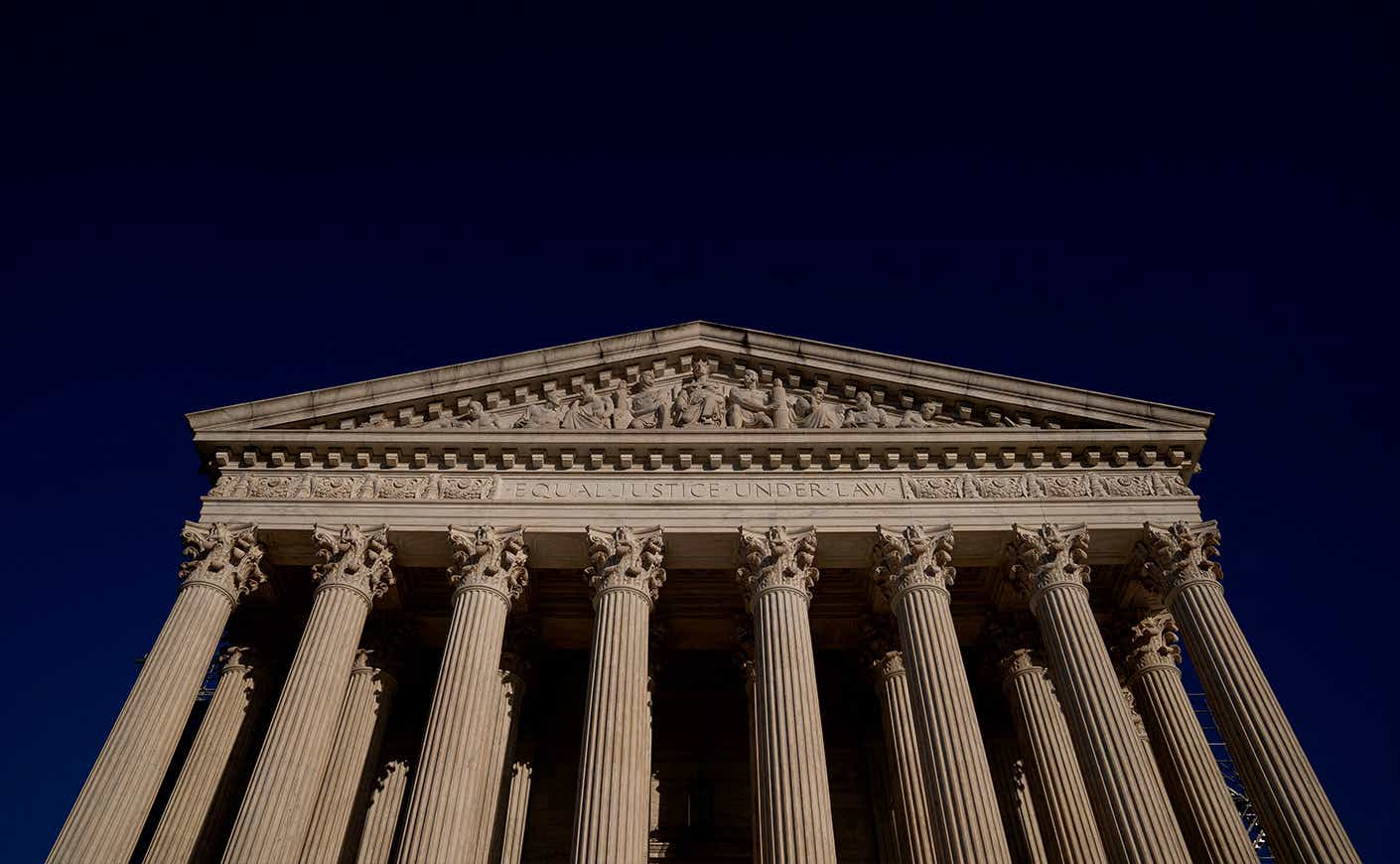 Supreme court on dark blue sky