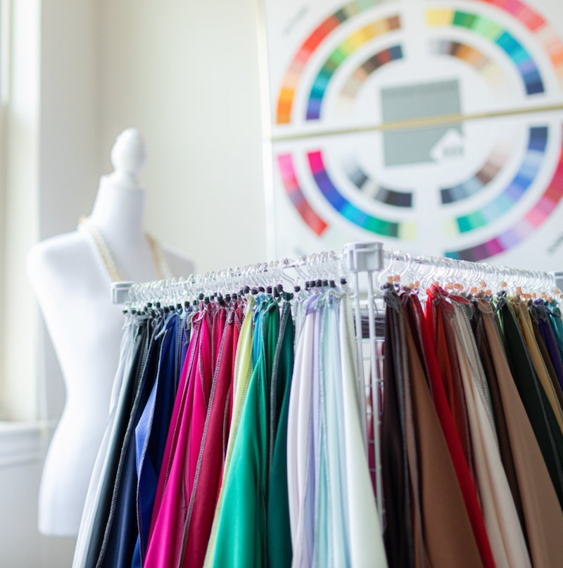 fabrics in front of a mannequin and color wheel