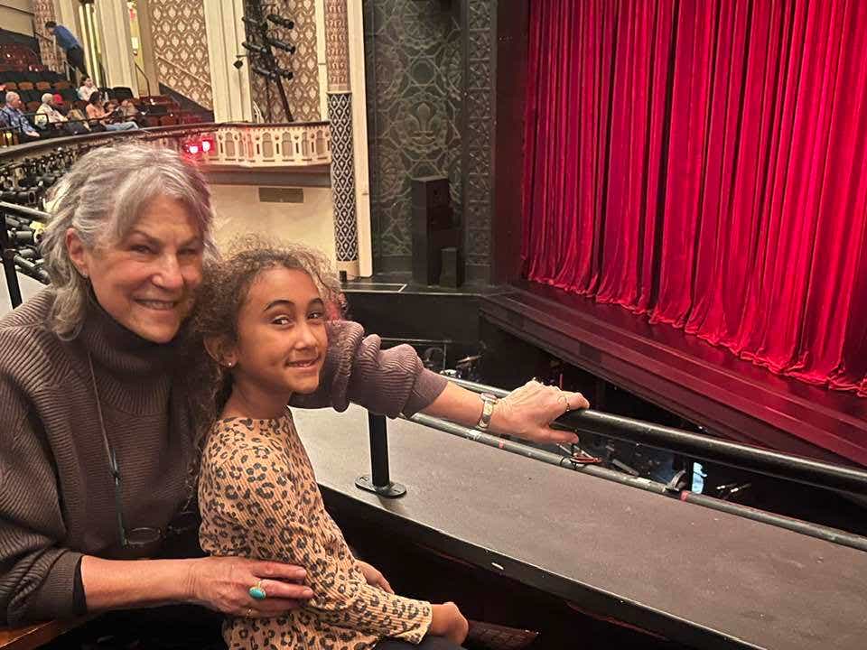 grandma and granddaughter at the theater
