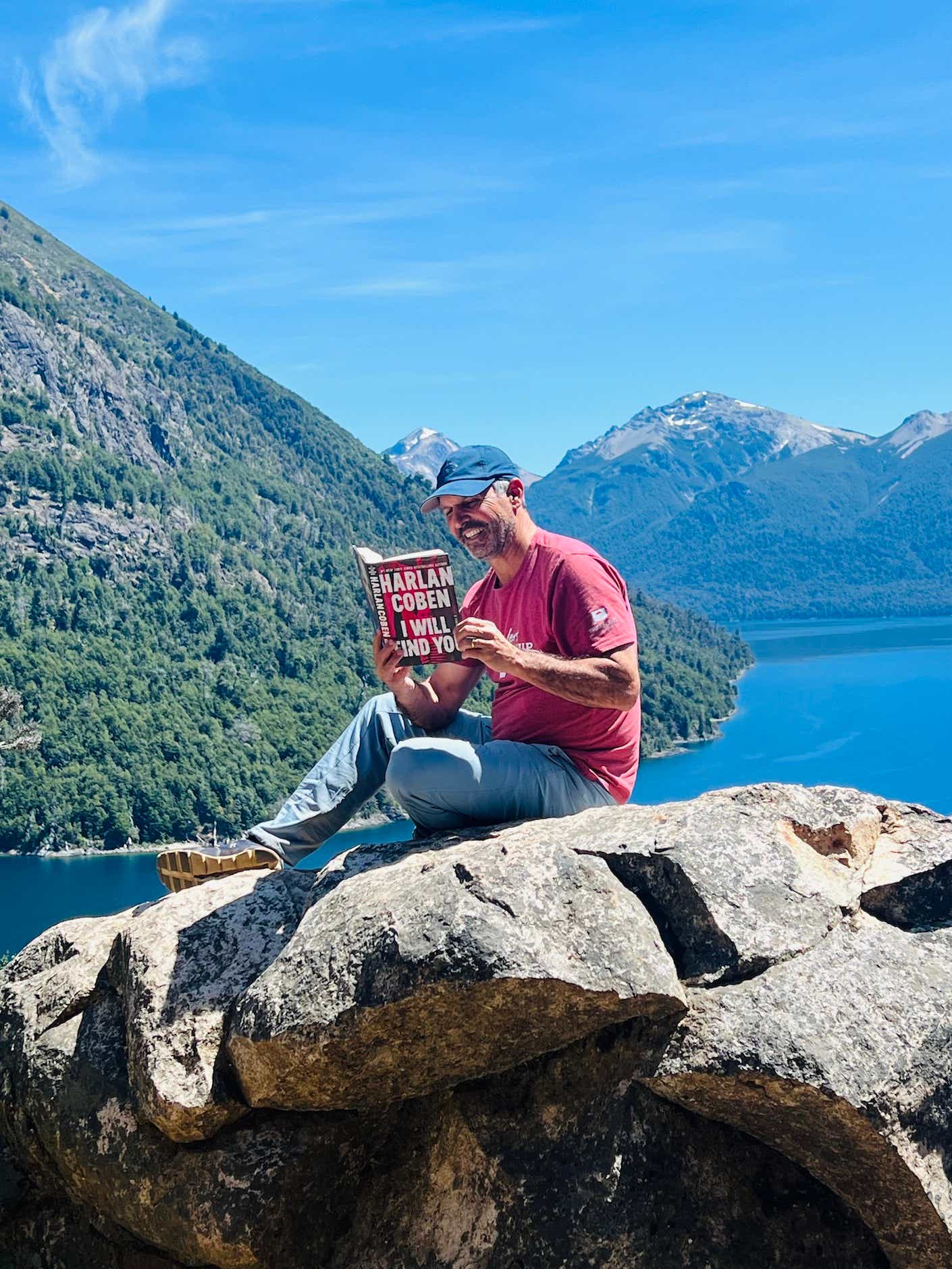 John reading a Harlan Cohen book in Argentina 