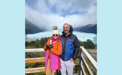 katie and john in front of a glacier in patagonia