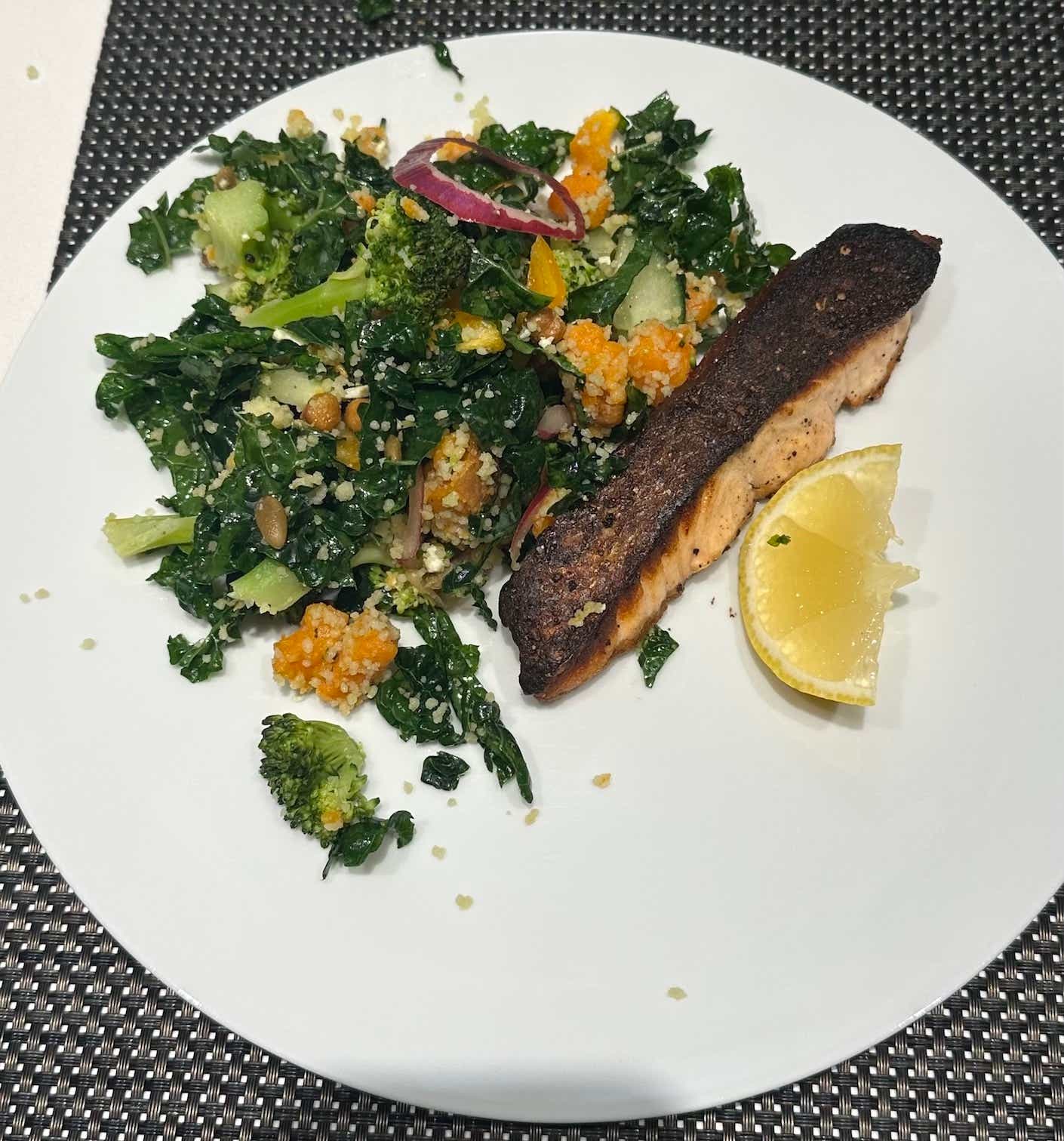 A plate of salmon and salad.