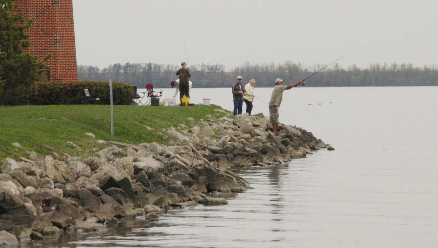 people fishing in storm lake