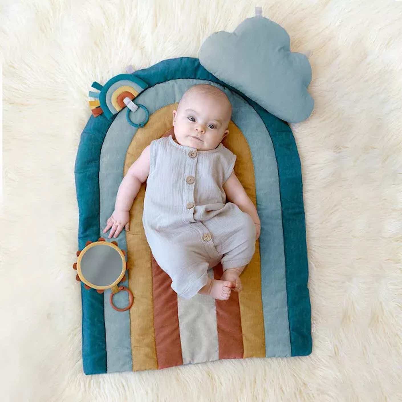 A baby on a tummy time mat