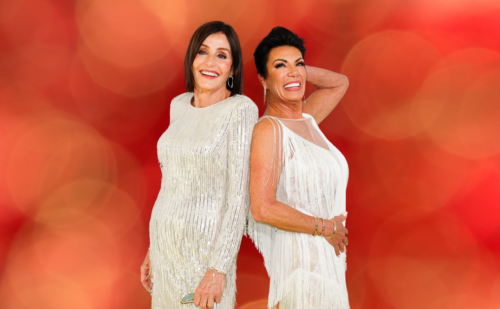 Kathy Swarts and Susan Noles pose in sparkly white outfits.