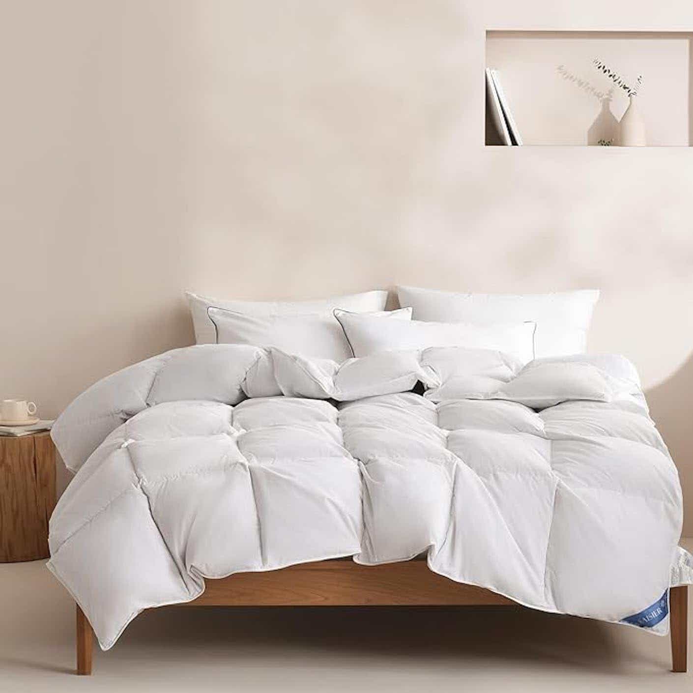 A bed with a duvet cover.