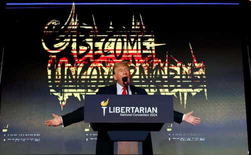 Donald Trump addresses the Libertarian Party National Convention at the Washington Hilton with a "Become Ungovernable" sign behind him