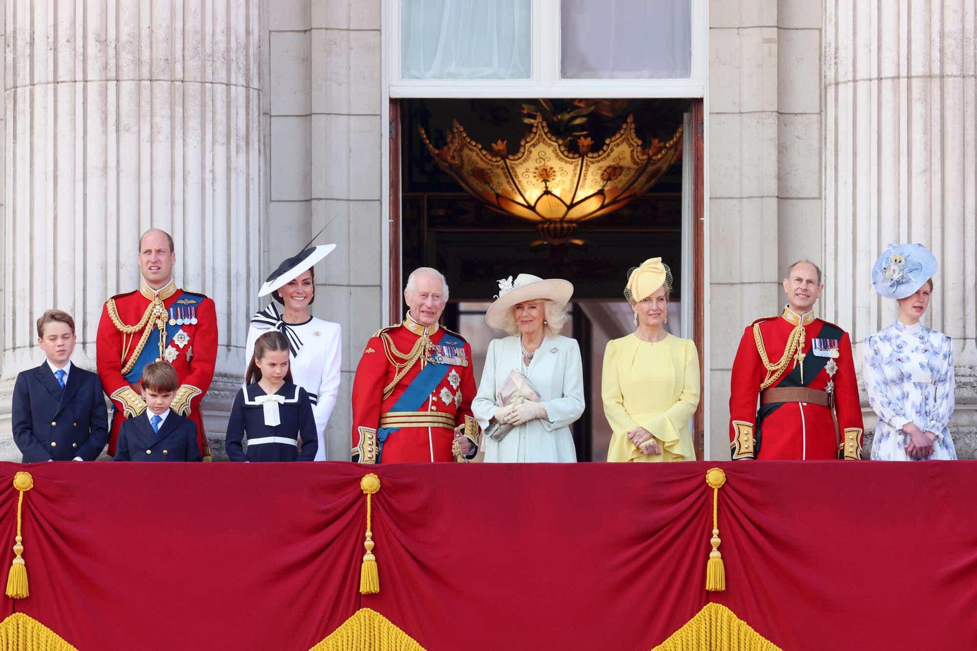 Prince William, Princess Catherine and their children with King Charles III and Queen Camilla stand on the balcony of Buckingham Palace after attending the King's Birthday Parade.