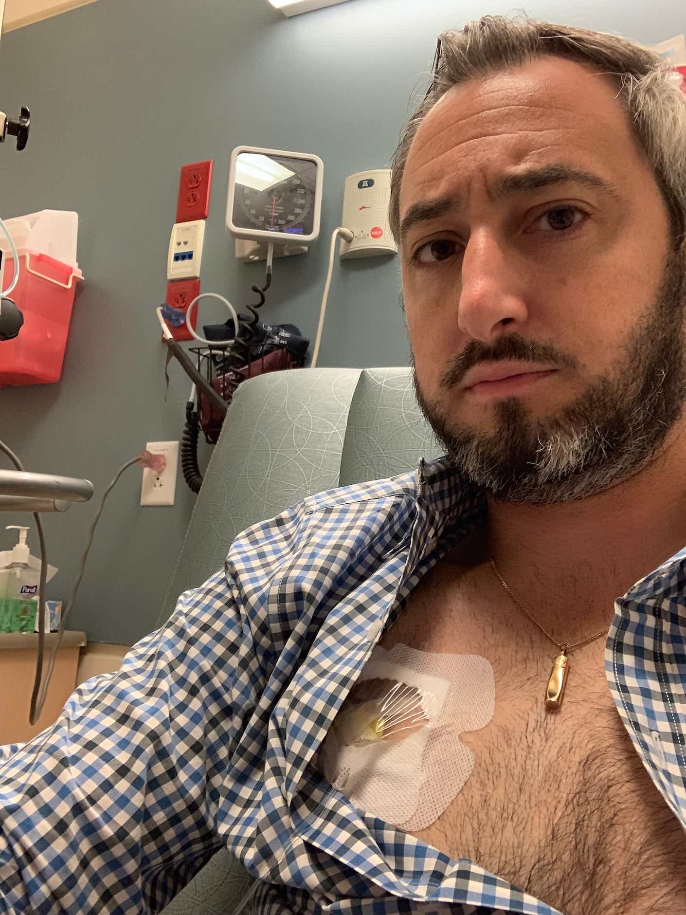 man in a hospital room undergoing testing 