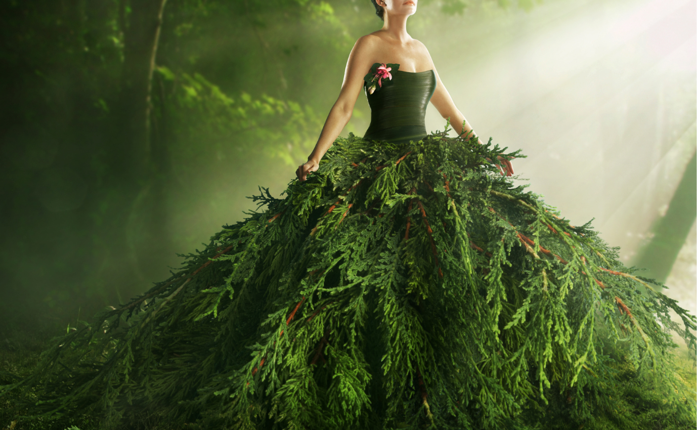 Woman wearing a dress made of plants