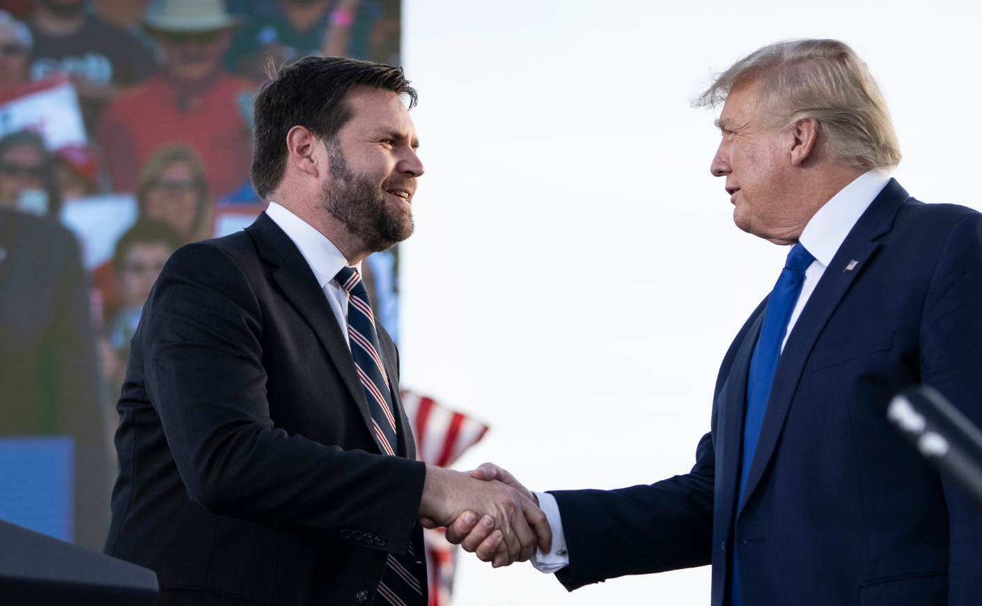 J.D. Vance shaking hands with Donald Trump