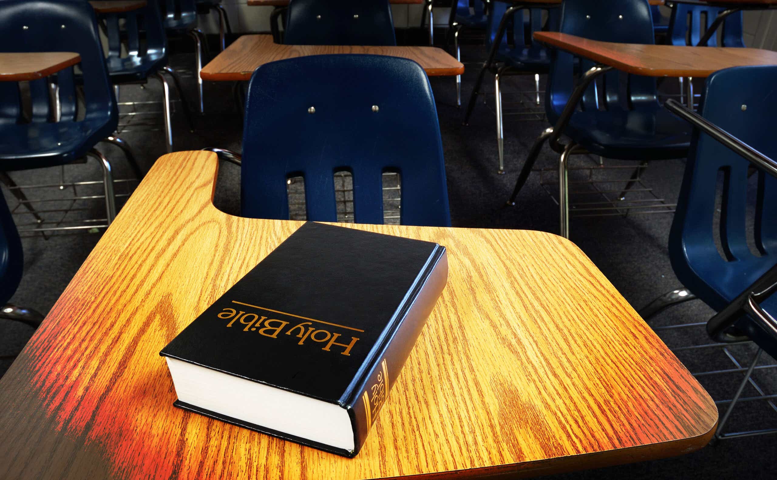 Bible on a classrom desk.