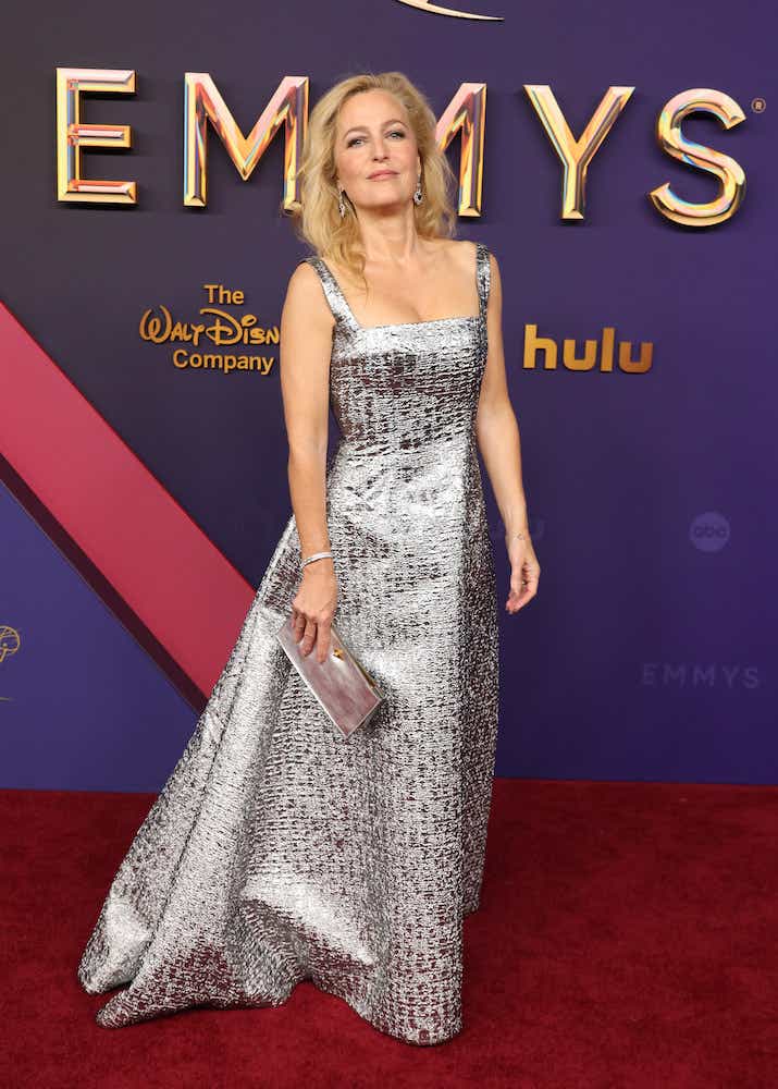 Gillian Anderson wears a silver gown to the Emmys.