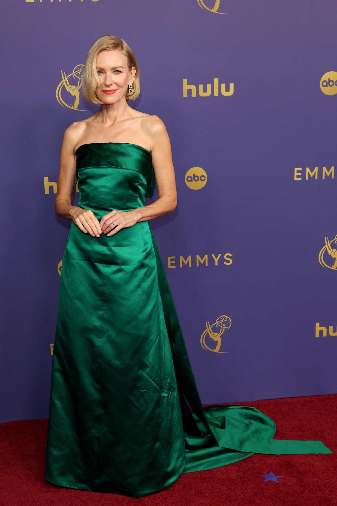 Naomi Watts in a green strapless satin gown