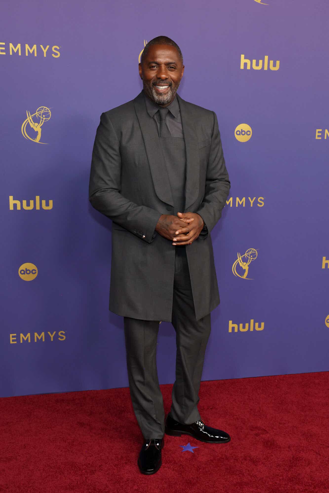 Idris Elba wears a gray suit to the Emmys.