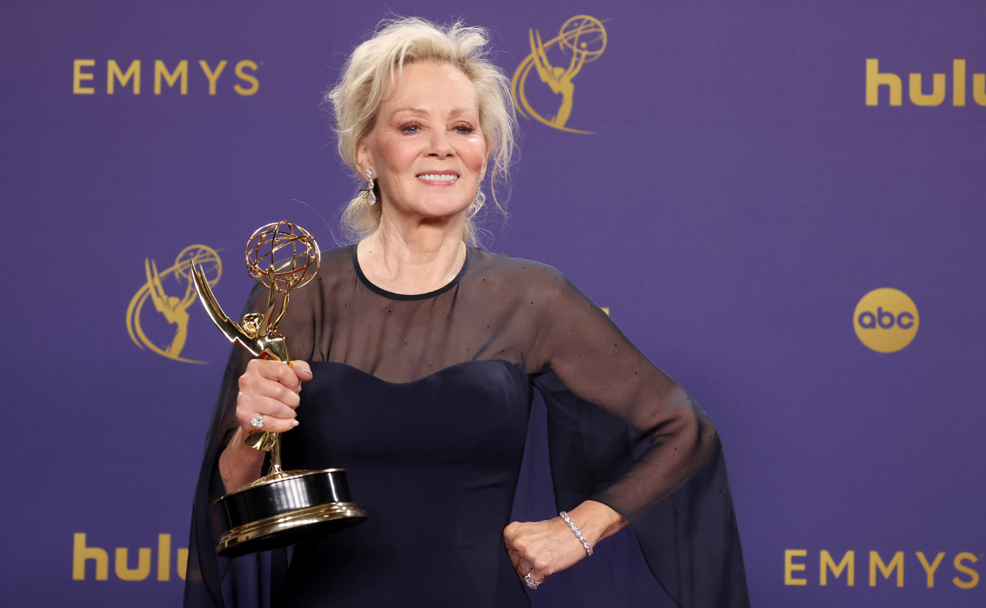 Jean Smart posing with her Emmy Award