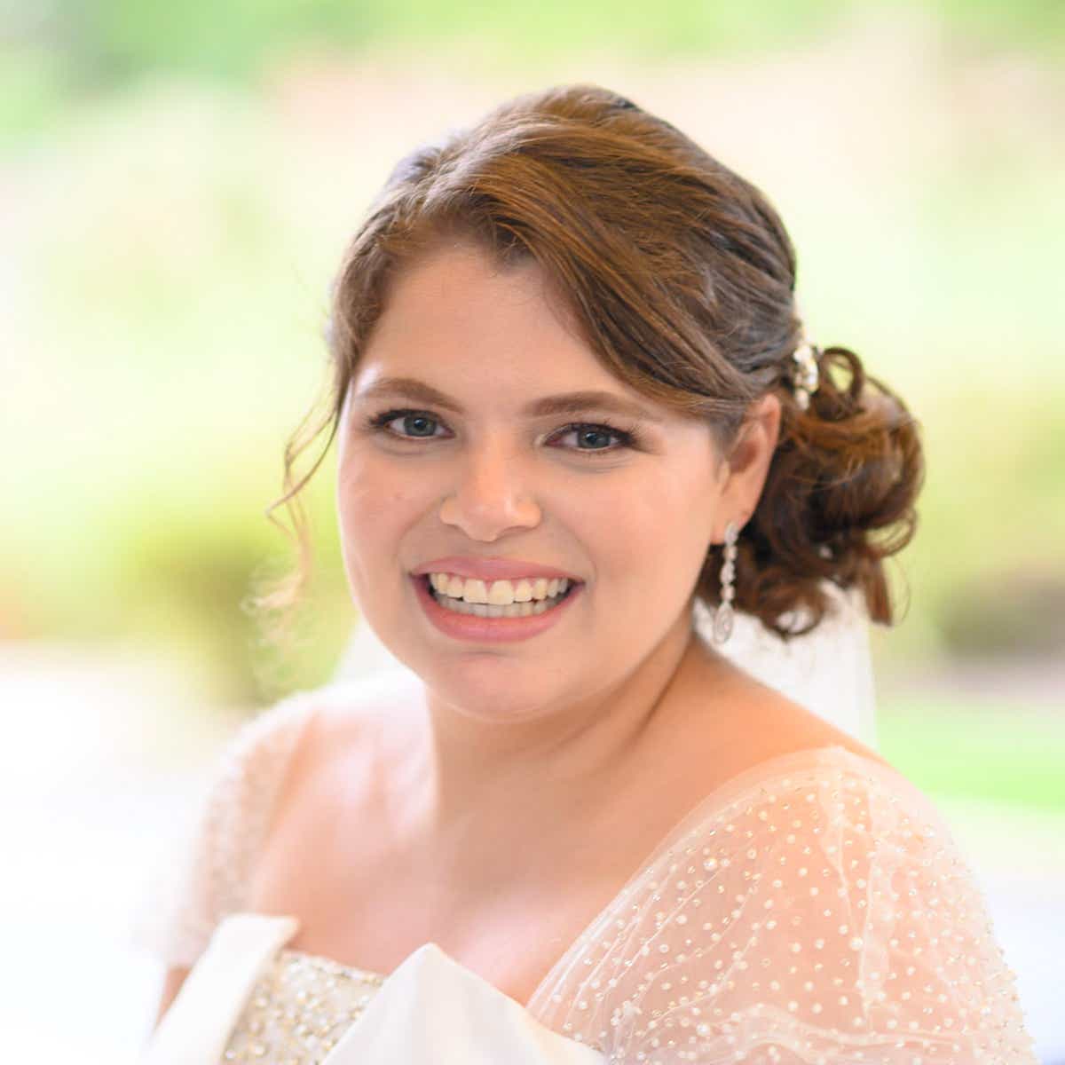 Headshot of Rachel smiling on her wedding day