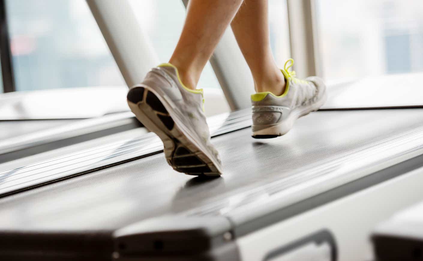 close-up of person's sneakers on a treadmill