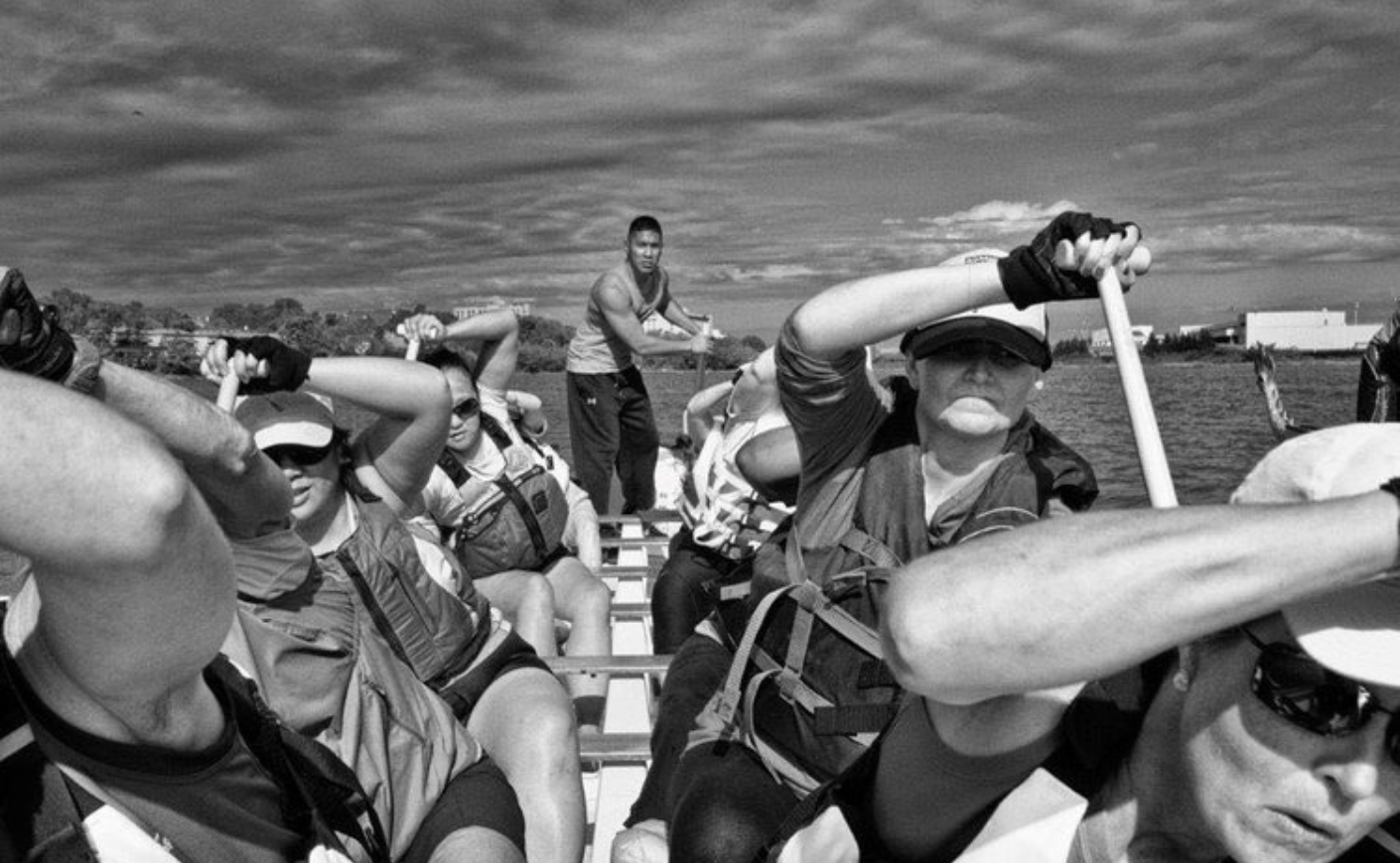 women paddling a dragon boat