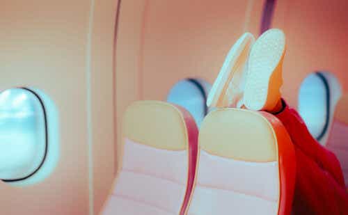 Passenger Putting her Shoes on the Seat in front