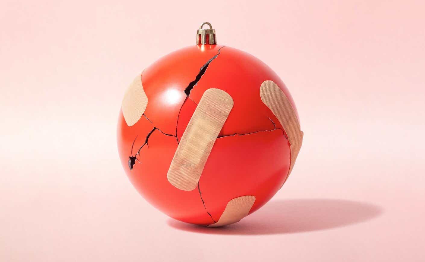 broken ornament held together by bandaids