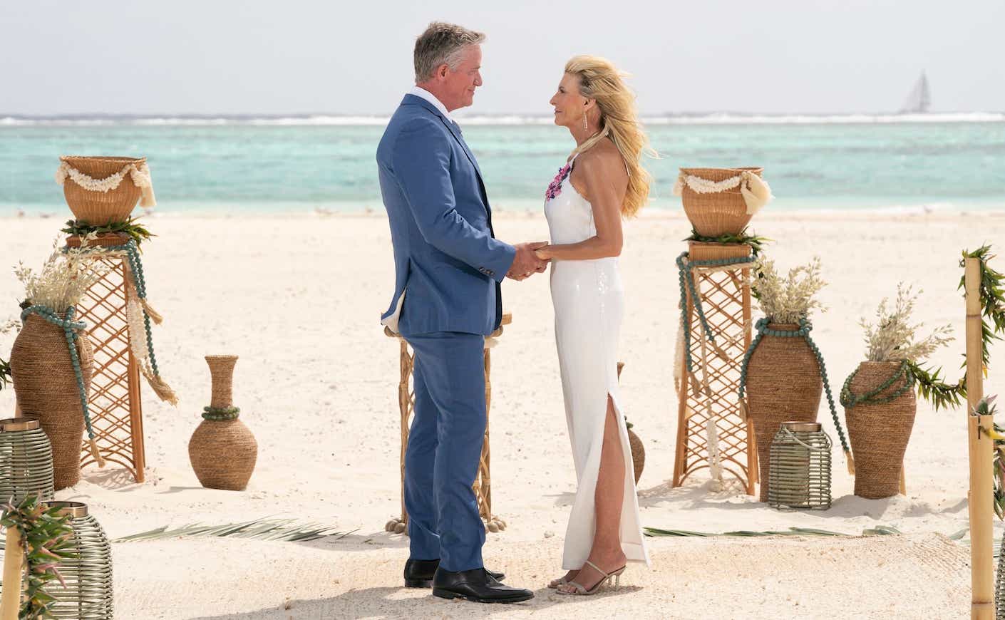 chock and joan on a beach on the golden bachelorette finale