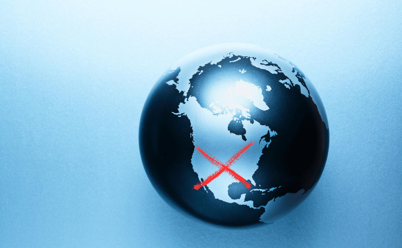 globe with a red X through the U.S.