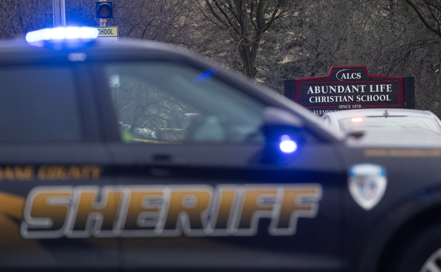 Sheriff's car pulling up outside a school