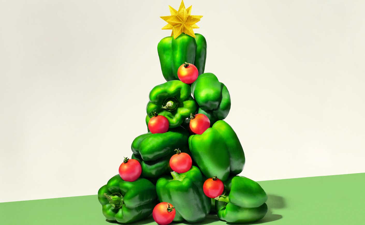 Bell peppers arranged into the shape of a Christmas tree with a star on top