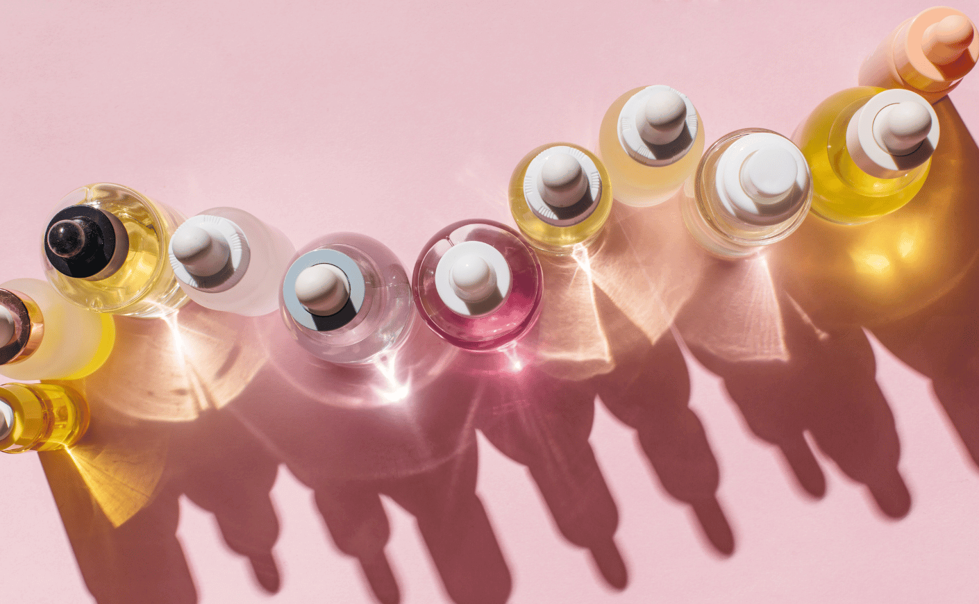 skinncare bottles on pink background