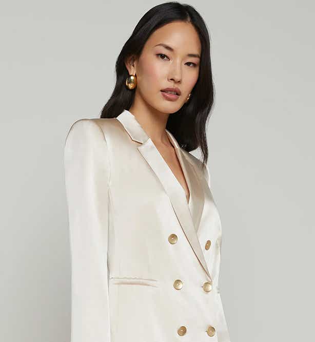 woman wearing cream silk blazer