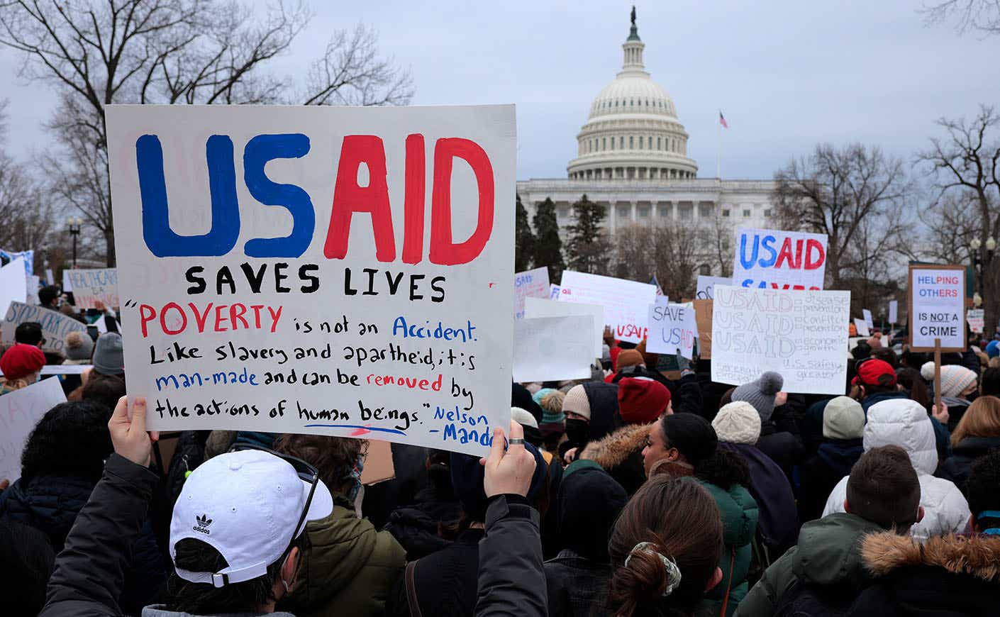 Protestors demonstrate in front of the U.S. Capitol in support of USAID