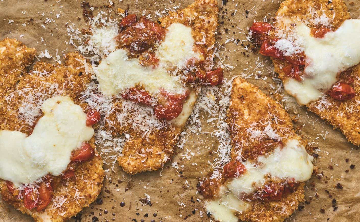 A tray of baked chicken parmesan.