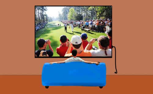 man watching golf on TV