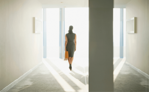 woman walking out of office