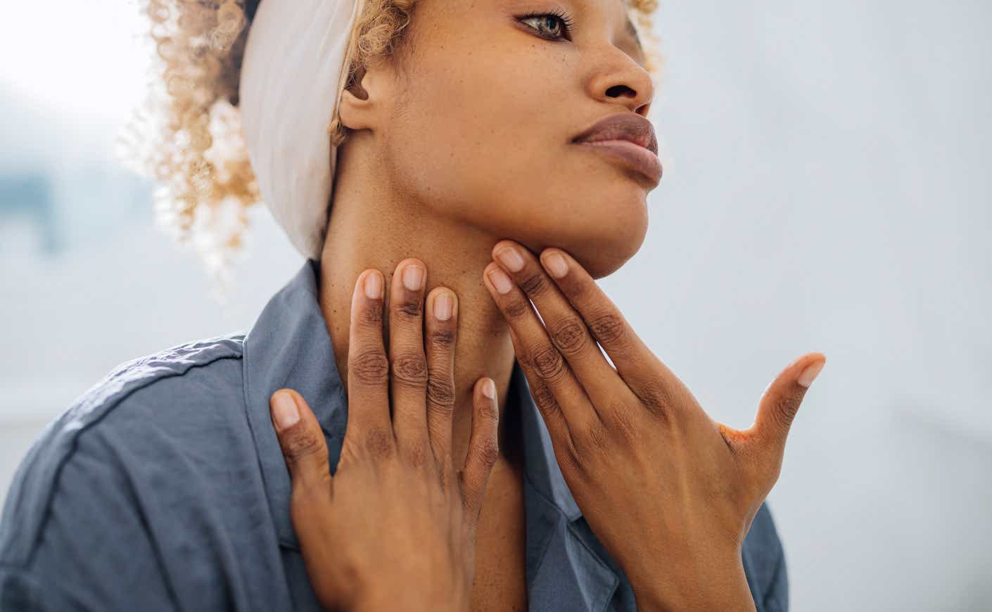 a woman massaging her face